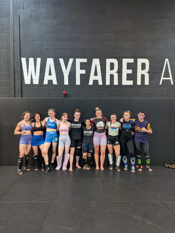 A group of women in shin guards lined up after an interclub at Wayfarer Academy